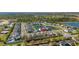 Stunning aerial view of a modern neighborhood surrounding a peaceful pond with fountain at 14321 Wabasso Loop, Winter Garden, FL 34787