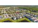 Bird's eye view of neighborhood featuring modern homes, and community ponds with fountains at 14321 Wabasso Loop, Winter Garden, FL 34787