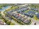 Wide aerial shot featuring community ponds, neighborhood streets and manicured lawns at 14321 Wabasso Loop, Winter Garden, FL 34787
