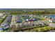 Attractive aerial shot of the neighborhood with a pond, green spaces, and well-maintained homes at 14321 Wabasso Loop, Winter Garden, FL 34787