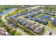 Aesthetic aerial view of a residential community with a water feature and well-manicured streets at 14321 Wabasso Loop, Winter Garden, FL 34787