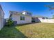 A spacious, fenced backyard with lush green grass and ample space at 14321 Wabasso Loop, Winter Garden, FL 34787