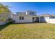 A spacious, fenced backyard with lush green grass and ample space at 14321 Wabasso Loop, Winter Garden, FL 34787