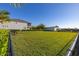Large fenced backyard provides ample green space, privacy, and views of a secondary structure on this property at 14321 Wabasso Loop, Winter Garden, FL 34787
