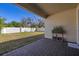 Backyard patio with stone pavers, planter, and a white privacy fence, perfect for outdoor relaxation at 14321 Wabasso Loop, Winter Garden, FL 34787