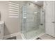 Modern bathroom features a spacious glass-enclosed shower with neutral tiling and ample natural light at 14321 Wabasso Loop, Winter Garden, FL 34787