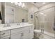 Well-lit bathroom featuring a white vanity, framed mirror, and a glass-enclosed shower at 14321 Wabasso Loop, Winter Garden, FL 34787