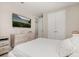 Bright bedroom featuring neutral tones, a modern platform bed, and a mounted television at 14321 Wabasso Loop, Winter Garden, FL 34787