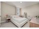 Cozy bedroom featuring neutral tones, a modern platform bed, and a stylish vanity area at 14321 Wabasso Loop, Winter Garden, FL 34787