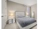Bright bedroom featuring neutral tones, a modern platform bed, and stylish nightstands at 14321 Wabasso Loop, Winter Garden, FL 34787
