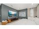 This bedroom has a tv, a couch, modern art, and neutral paint at 14321 Wabasso Loop, Winter Garden, FL 34787