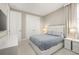 Bright bedroom featuring neutral tones, a modern platform bed, and spacious closet at 14321 Wabasso Loop, Winter Garden, FL 34787