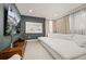 This bedroom has a tv, a couch, modern art, and neutral paint at 14321 Wabasso Loop, Winter Garden, FL 34787