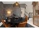 Elegant dining area featuring a round table, modern lighting, and stylish decor at 14321 Wabasso Loop, Winter Garden, FL 34787