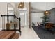 Open-concept interior with a dining area adjacent to a welcoming foyer and staircase at 14321 Wabasso Loop, Winter Garden, FL 34787