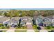 A charming home with a brick paver driveway, manicured lawn and a two-car garage at 14321 Wabasso Loop, Winter Garden, FL 34787