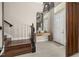 Elegant foyer with stairs, console table, and stylish decor at 14321 Wabasso Loop, Winter Garden, FL 34787