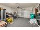 Spacious two-car garage providing ample storage and parking space for vehicles and equipment at 14321 Wabasso Loop, Winter Garden, FL 34787