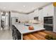 Large kitchen island with bar seating, white cabinetry, and stainless steel appliances at 14321 Wabasso Loop, Winter Garden, FL 34787