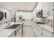 Bright kitchen featuring stainless steel appliances, granite counters, and a large center island at 14321 Wabasso Loop, Winter Garden, FL 34787