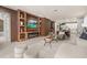 Living area boasts custom wooden built-ins, fireplace, and modern finishes, creating a cozy ambiance at 14321 Wabasso Loop, Winter Garden, FL 34787
