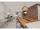 Open-concept living and dining area with modern furniture and large windows at 14321 Wabasso Loop, Winter Garden, FL 34787
