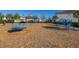 Community playground with swings, merry-go-round and climbing equipment offers safe fun for children with shade structure nearby at 14321 Wabasso Loop, Winter Garden, FL 34787