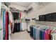 Spacious walk-in closet featuring ample storage with organized shelving and hanging racks for clothes and accessories at 14321 Wabasso Loop, Winter Garden, FL 34787