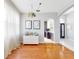 Dining room with hardwood floors, modern lighting, white walls, and archway to kitchen at 1718 Golfview Dr, Kissimmee, FL 34746