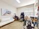 This room features a salon setup with white sofa and black salon chair at 1718 Golfview Dr, Kissimmee, FL 34746