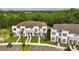 An aerial shot showcases the stylish townhomes and well-maintained landscaping at 17238 Blessing Dr, Clermont, FL 34714