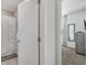 Bathroom and bedroom including a shower, mirror, open door to bedroom, and modern finishes at 17238 Blessing Dr, Clermont, FL 34714