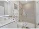 A stylish bathroom with vanity, illuminated mirror, and glass-enclosed shower at 17238 Blessing Dr, Clermont, FL 34714