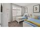 Cozy bedroom with two twin beds, natural light, and playful decor at 17238 Blessing Dr, Clermont, FL 34714