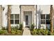 Charming two-story home featuring stacked stone accents and manicured landscaping at 17238 Blessing Dr, Clermont, FL 34714