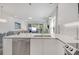 Stylish kitchen with a modern island, stainless steel appliances, and integrated living space at 17238 Blessing Dr, Clermont, FL 34714