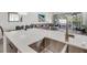 Open-concept kitchen with a double sink, flowing into the living room for easy entertaining at 17238 Blessing Dr, Clermont, FL 34714