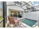 Tranquil screened in outdoor patio with jacuzzi tub and lounge chairs at 17238 Blessing Dr, Clermont, FL 34714
