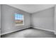 Bedroom featuring gray tile flooring, neutral walls and a window to let in natural light at 1783 Coriander Dr, Kissimmee, FL 34759