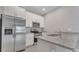 Modern kitchen features stainless steel appliances and sleek granite countertops at 1783 Coriander Dr, Kissimmee, FL 34759