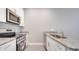 Modern kitchen with stainless steel appliances and beautiful granite countertops at 1783 Coriander Dr, Kissimmee, FL 34759