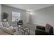 Inviting living room showcasing natural light, simple decor, and spacious tile flooring at 1783 Coriander Dr, Kissimmee, FL 34759