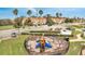 View of the community playground area near the townhomes and manicured landscaping at 1785 Coriander Dr, Kissimmee, FL 34759