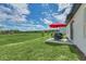 Spacious backyard with patio and seating, ideal for outdoor entertaining and enjoying nature at 2039 Derwent Dr, Davenport, FL 33896