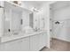 Bright bathroom with double vanity, white quartz countertops, and walk in closet at 2039 Derwent Dr, Davenport, FL 33896
