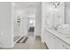 Bright bathroom with double vanity, white quartz countertops, glass shower, and access to the bedroom at 2039 Derwent Dr, Davenport, FL 33896