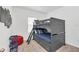 Bedroom with blue bedding, Star Wars decor, dark bunk bed, and a window at 2039 Derwent Dr, Davenport, FL 33896