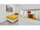 Bright bedroom with yellow bedding, Mickey Mouse themed decor, and a white bunk bed at 2039 Derwent Dr, Davenport, FL 33896