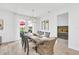 Dining area with a wooden table, seating for eight, and a view into the primary bedroom at 2039 Derwent Dr, Davenport, FL 33896
