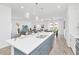 Open-concept kitchen with stainless steel appliances and a large island for entertaining at 2039 Derwent Dr, Davenport, FL 33896